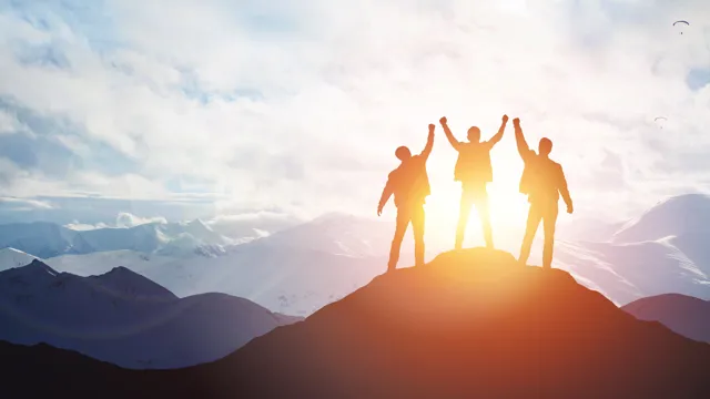 Threepeoplecheeringontopofmountain_2023