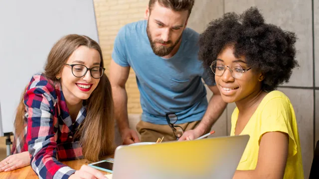 Threepeoplesmilingatlaptop_2023