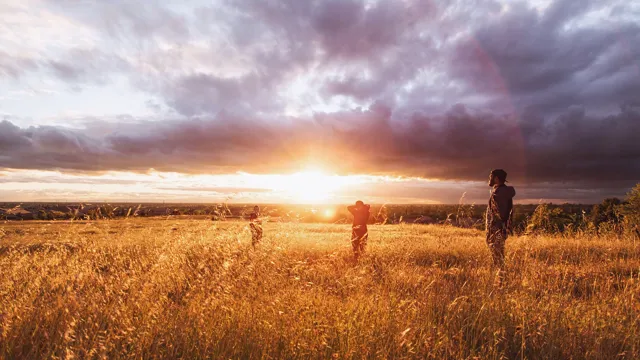 Guystandinginfrontofsunset_2022