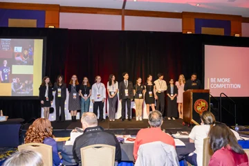All Be More finalists stand on stage